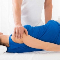 Masseur Doing Massage On Woman